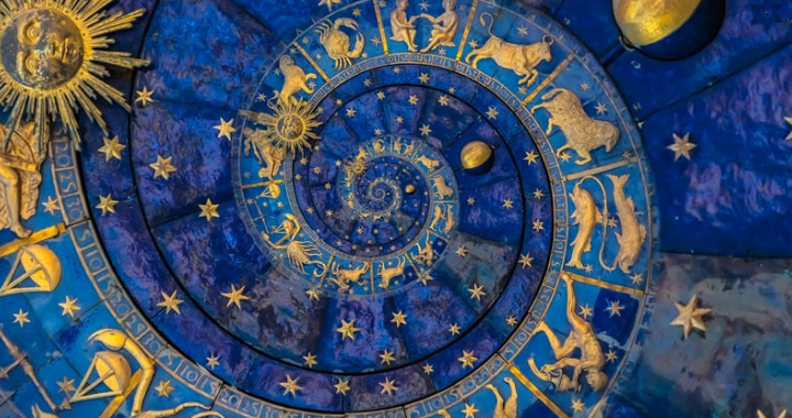 Abstract birth chart with golden symbols and blue background, showcasing astrological chart basics